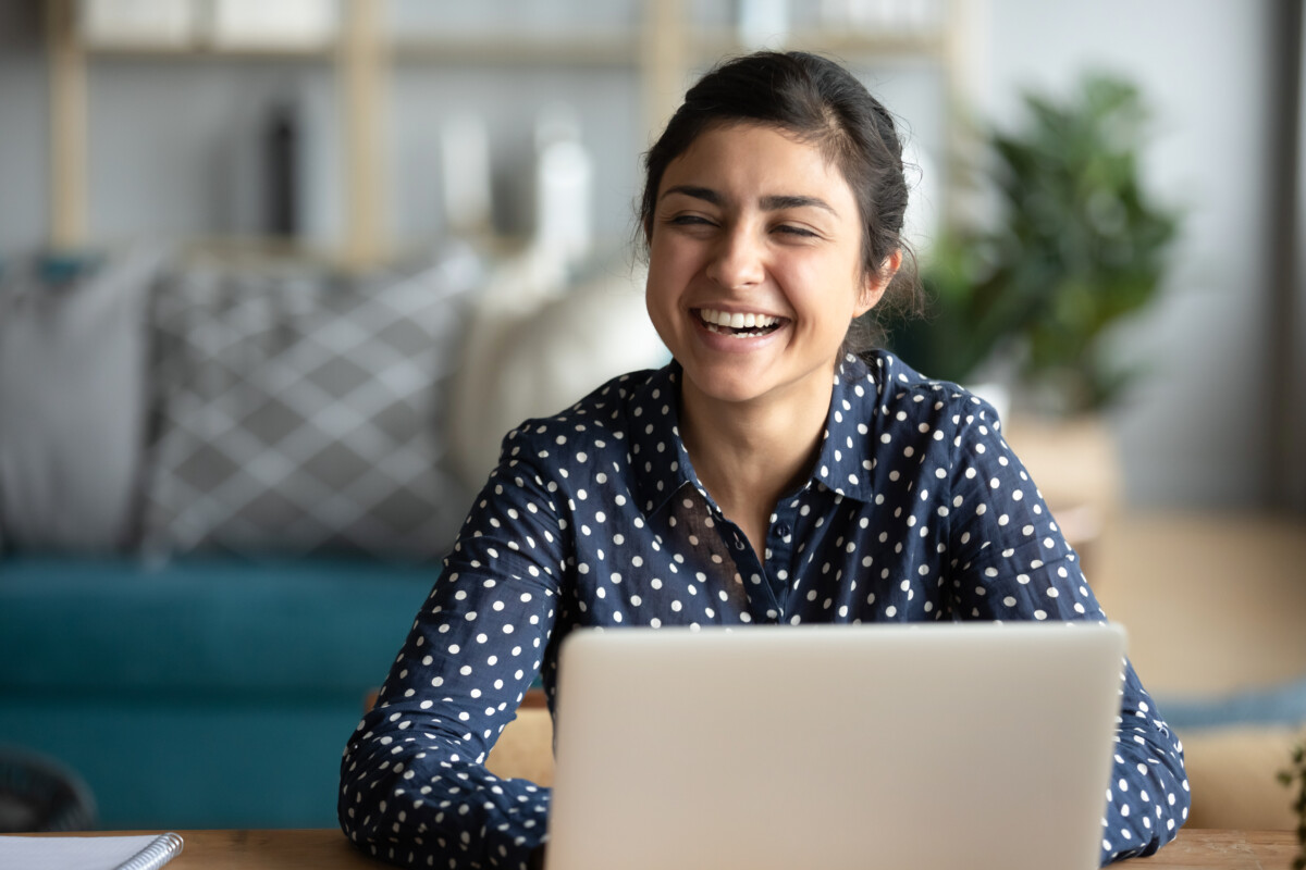 Happy woman on a computer